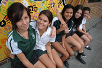 Aboriginal schoolgirls on a bench